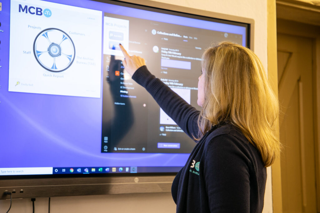 Medical-Clerical-Bureau-Cheryl-Luscombe-with-case-coordinator-touchscreen-computer